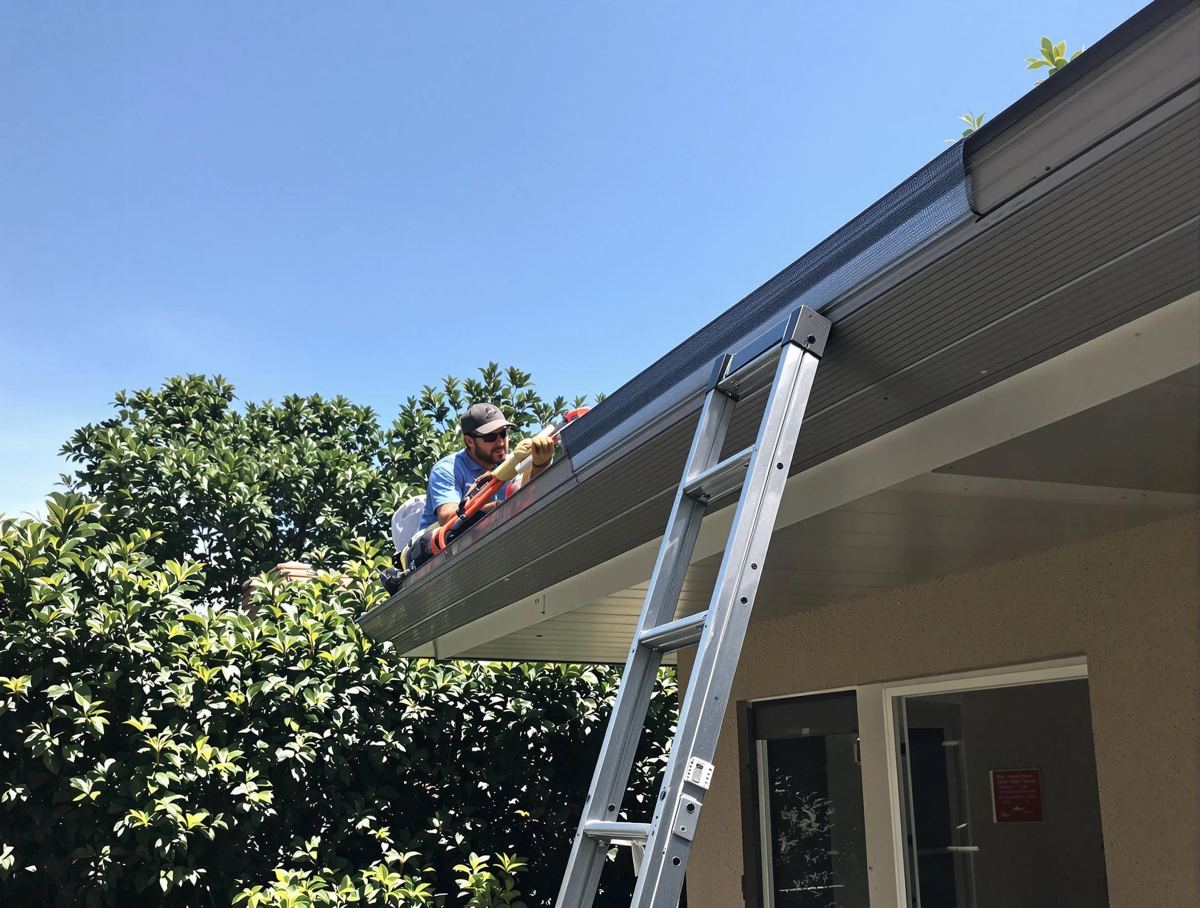 Streetsboro Roofing Company installing gutter guards for a homeowner in Streetsboro, OH